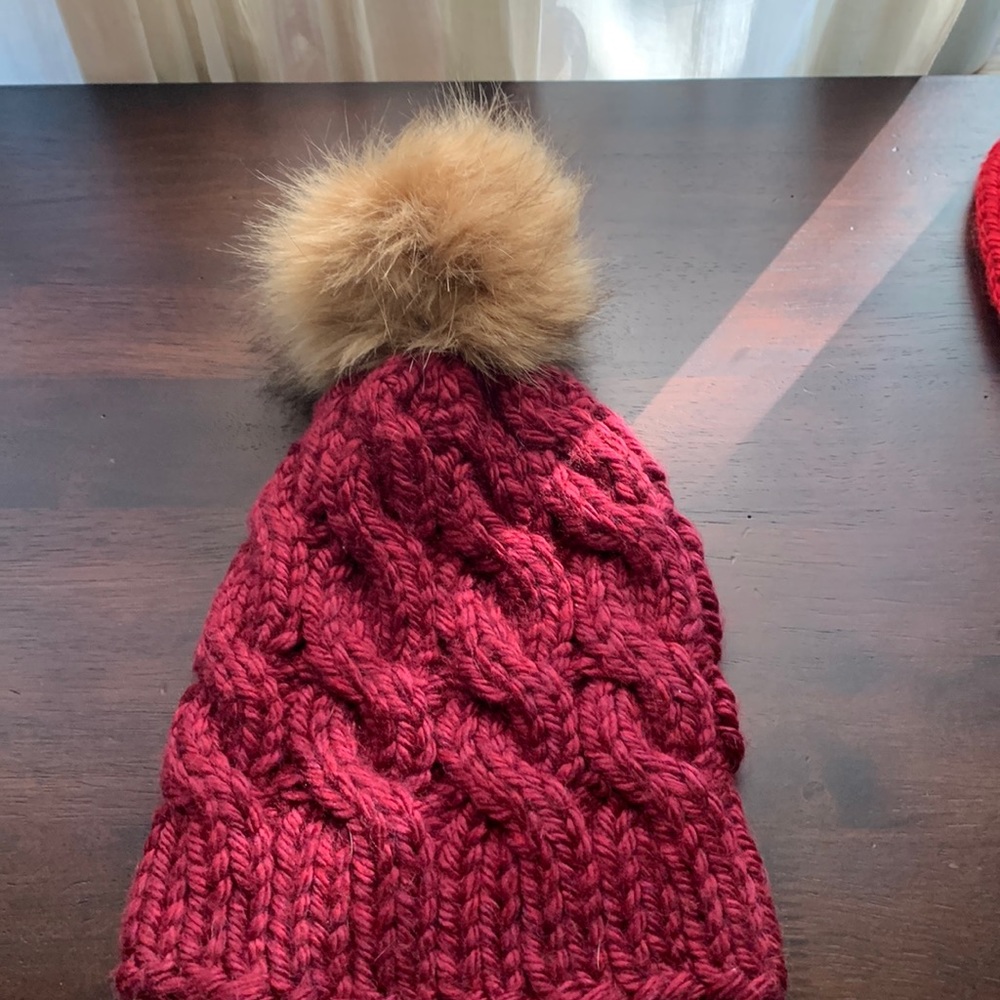 Crocheted winter beanie with tassel.